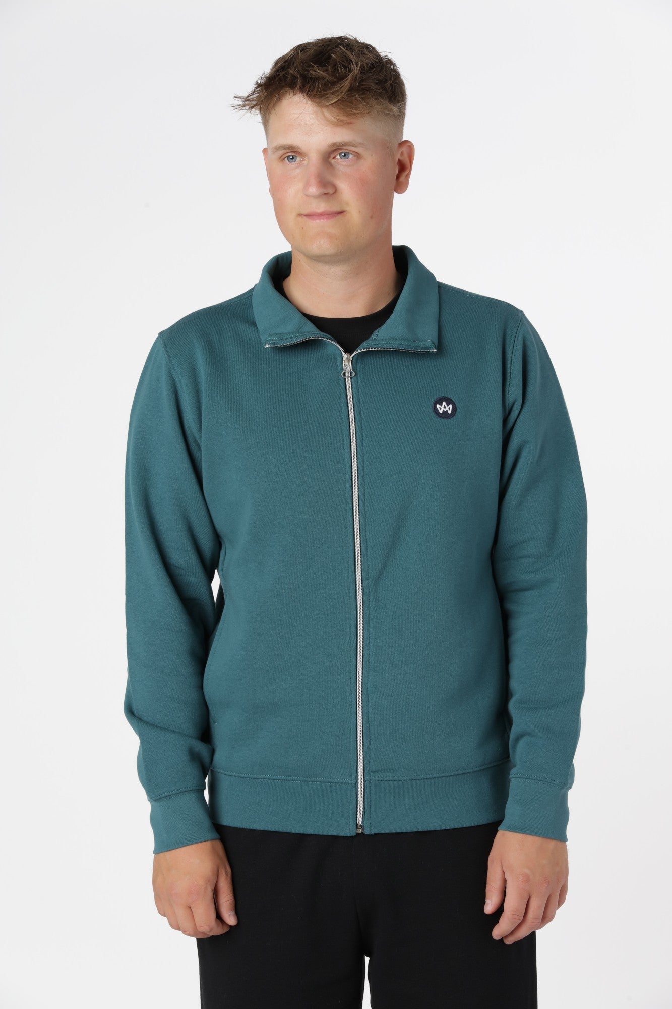 Kronstadt Zip-up i farven Mediterranea med afslappet pasform og gennemgående lynlås i blågrøn tone